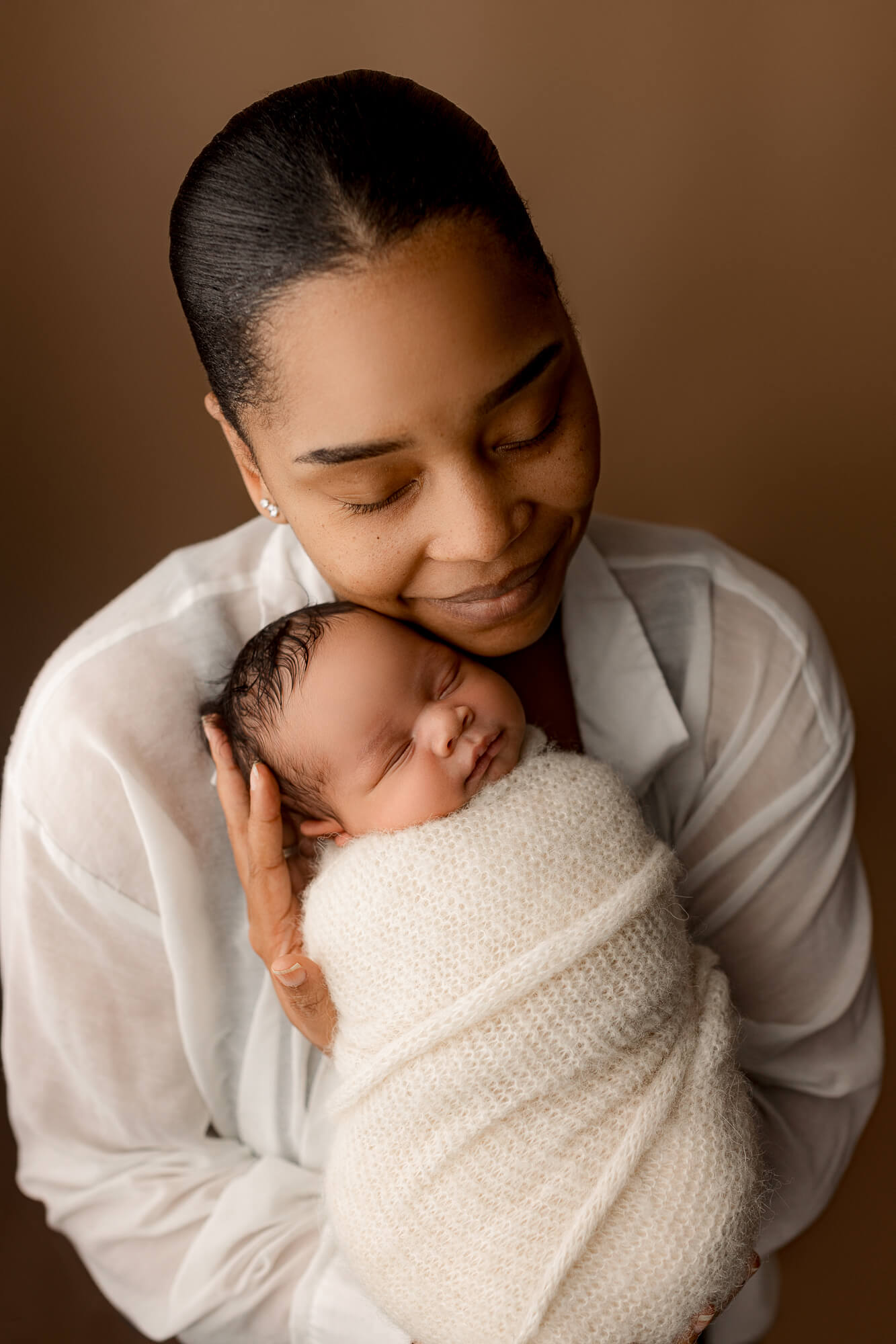 mom captured with baby during an Atlanta newborn photography session