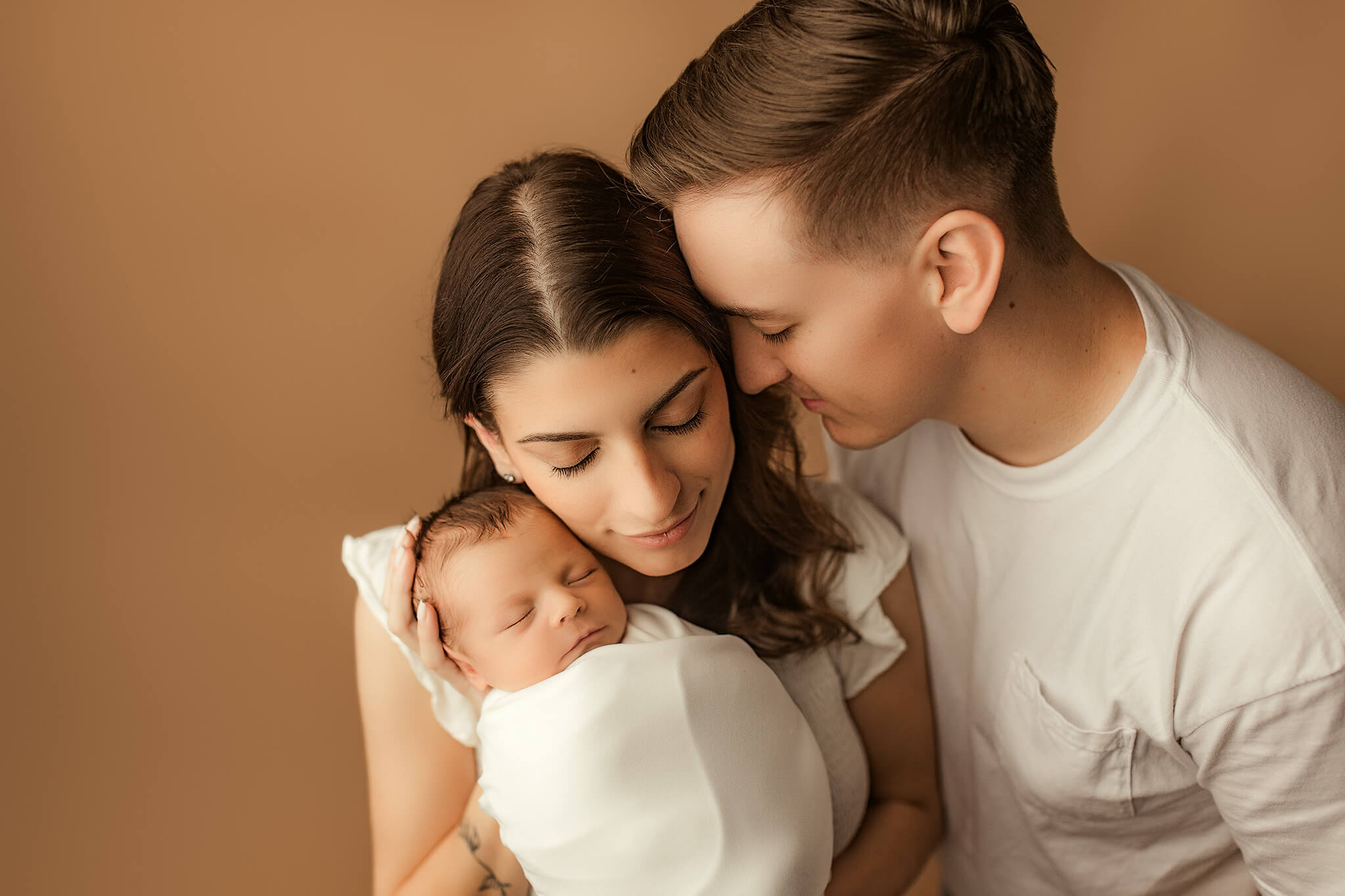 family portrait of mom, dad, and baby during woodstock newborn photography session