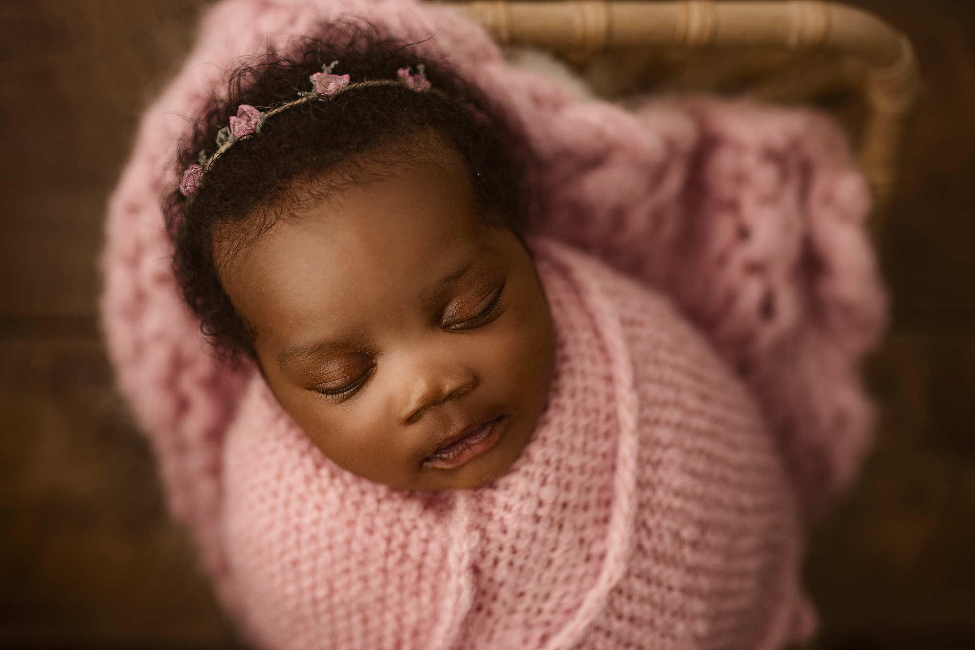 atlanta newborn swaddled in pink at newborn portrait session