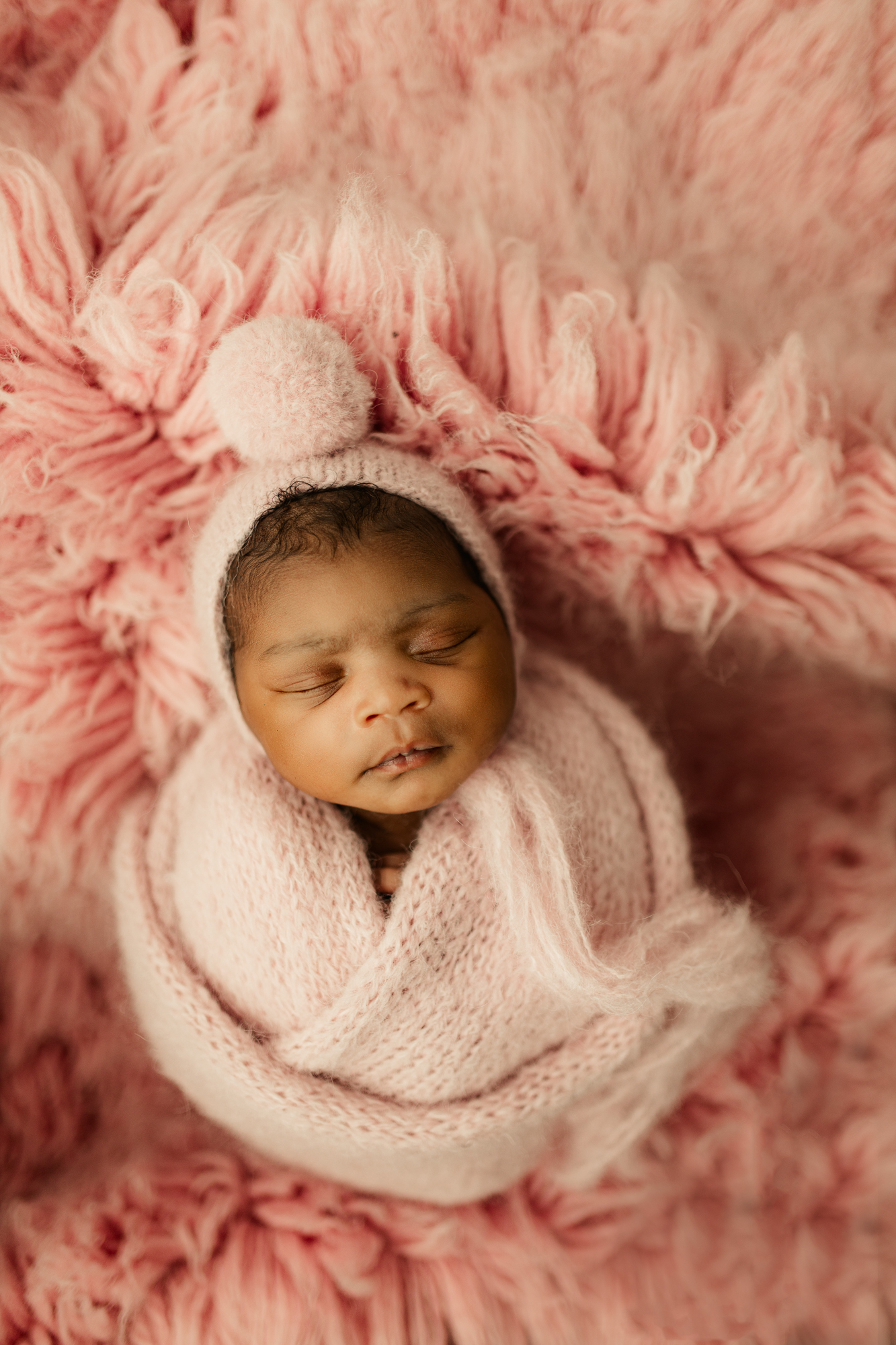 baby born by atlanta midwife captured in pink during her newborn session