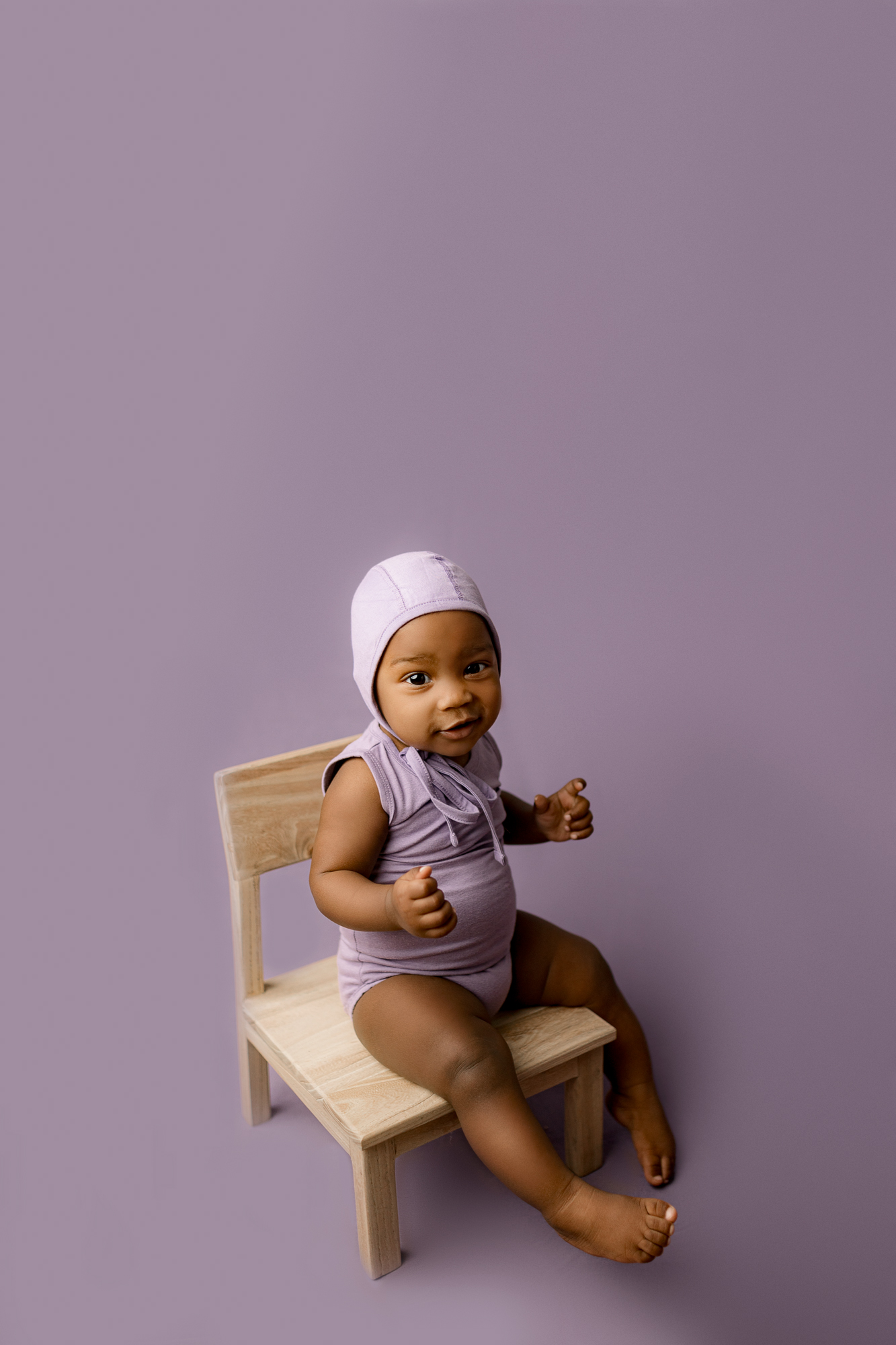 atlanta pediatrician baby in purple during portrat session